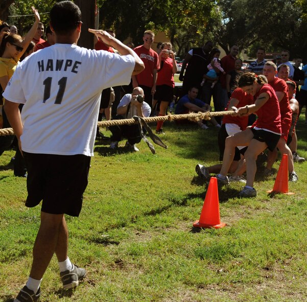 Airmen from the 2nd Contracting Squadron compete in a game of tug-of-war during the 2nd Mission Support Group Olympics at Barksdale Air Force Base, La. Oct. 28. Airmen competed in several different sports during the Olympics including soccer, golf, basketball and racquetball. (U.S. Air Force photo/Senior Airman Brittany Y. Bateman)
