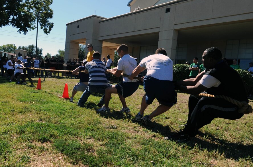 Airmen from the 2nd Civil Engineer Squadron compete against the 2nd Security Forces Squadron in a game of tug-of-war during the 2nd Mission Support Group Olympics at Barksdale Air Force Base, La. Oct. 28. Airmen competed in several different sports during the Olympics including soccer, golf, basketball and racquetball. (U.S. Air Force photo/Senior Airman Brittany Y. Bateman)