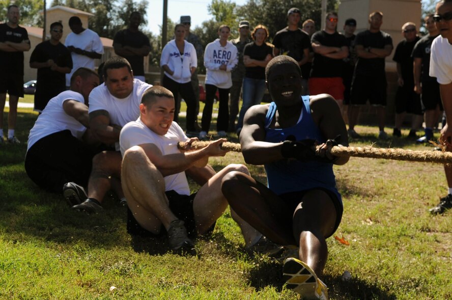 Airmen from the 2nd Security Forces Squadron compete in a game of tug-of-war during the 2nd Mission Support Group Olympics at Barksdale Air Force Base, La. Oct. 28. The 2 MSG consists of more than 2,600 members who host 11,500 military, civilian, reserve personnel, 18,000 retirees and 28,000 family members on a base of 22,000 acres. (U.S. Air Force photo/Senior Airman Brittany Y. Bateman)