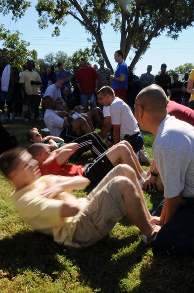 First Sergeants compete in the squadron command challenge during the 2nd Mission Support Group Olympics at Barksdale Air Force Base, La. Oct. 28. The challenge consisted of sit-ups, push-ups and an arm wrestling match for all the squadron?s leadership. (U.S. Air Force photo/Senior Airman Brittany Y. Bateman)