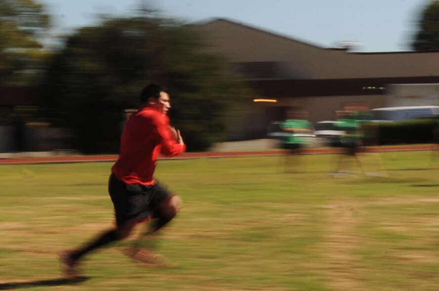 An Airman from the 2nd Contracting Squadron runs down the field during a game of ultimate football at Barksdale Air Force Base, La. Oct. 28. The Airmen competed in several different sports during the 2nd Mission Support Group Olympics including soccer, golf, basketball and racquetball. (U.S. Air Force photo/Senior Airman Brittany Y. Bateman)