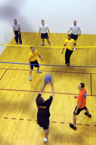 Airmen from the 2nd Communications Squadron compete against the 2nd Contracting Squadron in a game of walleyball during the 2nd Mission Support Group Olympics at Barksdale Air Force Base, La. Oct. 28. Airmen competed in several different sports during the Olympics including soccer, golf, basketball and racquetball. (U.S. Air Force photo/Senior Airman Brittany Y. Bateman)