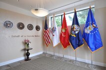 The entry to the Center for Families of the Fallen displays the seals and flags of each branch of service. (U.S. Air Force photo/Senior Airman Jonathan Young)