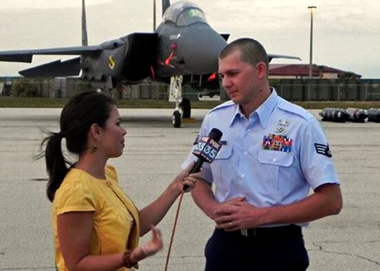 Senior Airman Brandon Harrell is interviewed by media during Air Force Week in Cocoa Beach. The explosive ordinance technician from the 96th Civil Engineer Group represented his service Oct. 28-30 there as a hometown hero. He was recognized recently for his efforts in Afghanistan where he was fired upon when responding to an explosion of a 15-pound improvised explosive device that took two lives in 2009. The Air Force Week program is part of a proactive approach to public communication and community relations.  Each Air Force week includes community visits and talks by Air Force officials, flight demonstration team performances, and displays providing a detailed look at the women and men of the United States Air Force serving on the front lines.  (Courtesy photo)