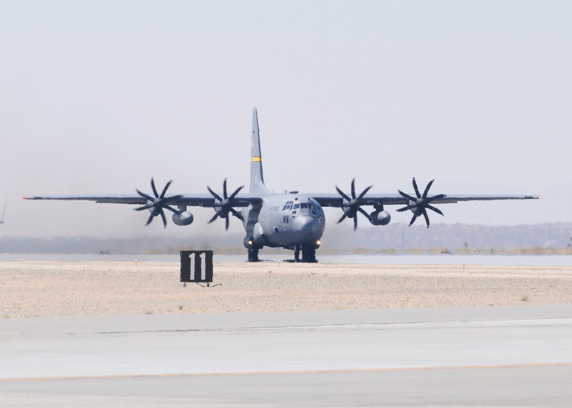 Edwards' C-130H3 with eight-bladed NP 2000 propellers, taxis down the runway during a flight test this summer.  The NP 2000 props are designed to provide more thrust and perform more efficiently.  (Air Force photo by John Perry)