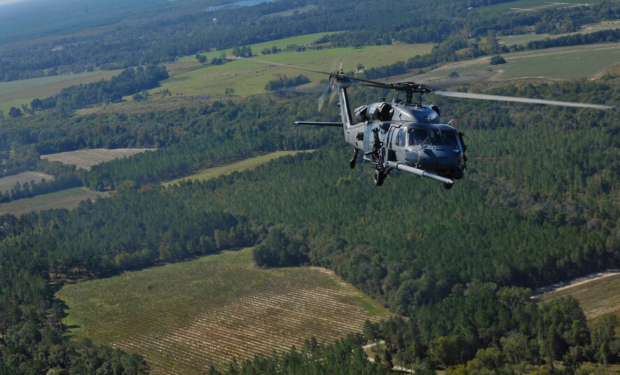 MOODY AIR FORCE BASE, Ga. -- An HH-60G Pave Hawk flies behind an HC-130P Combat King before in-flight refueling during a combat search and rescue airpower demonstration here Oct. 29. The CSAR demo was held for individuals attending the Flying Tigers Reunion, which is held annually.
(U.S. Air Force photo/Airman 1st Class Joshua Green)(RELEASED)
