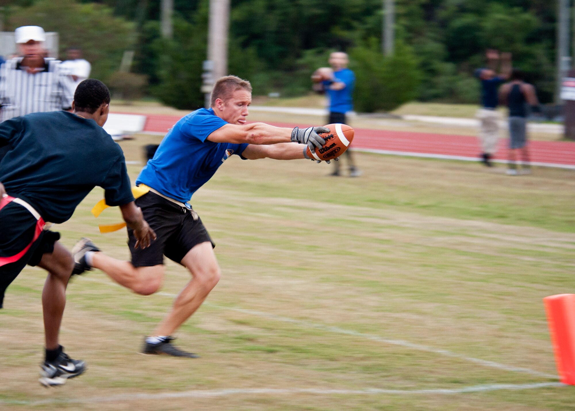 Brian Irish, 53rd Wing, reaches for the goal line during an intramural playoff game against 96th Security Forces Squadron, Nov. 2 at Eglin Air Force Base, Fla.   The 53rd won the game 19-13 to advance in the tournament.  Irish had two touchdowns including an end zone-to-end zone interception in the win.  The championship game is Nov. 9 at 5 p.m.  (U.S. Air Force photo/Samuel King Jr.) 
