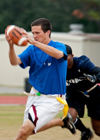 Brad Clinger, quarterback for the 53rd Wing, runs for more yards against the 96th Security Forces team, during their intramural playoff game Nov. 2 at Eglin Air Force Base, Fla.  The 53rd won the game 19-13 to advance in the tournament.  The championship game is Nov. 9 at 5 p.m.  (U.S. Air Force photo/Samuel King Jr.)