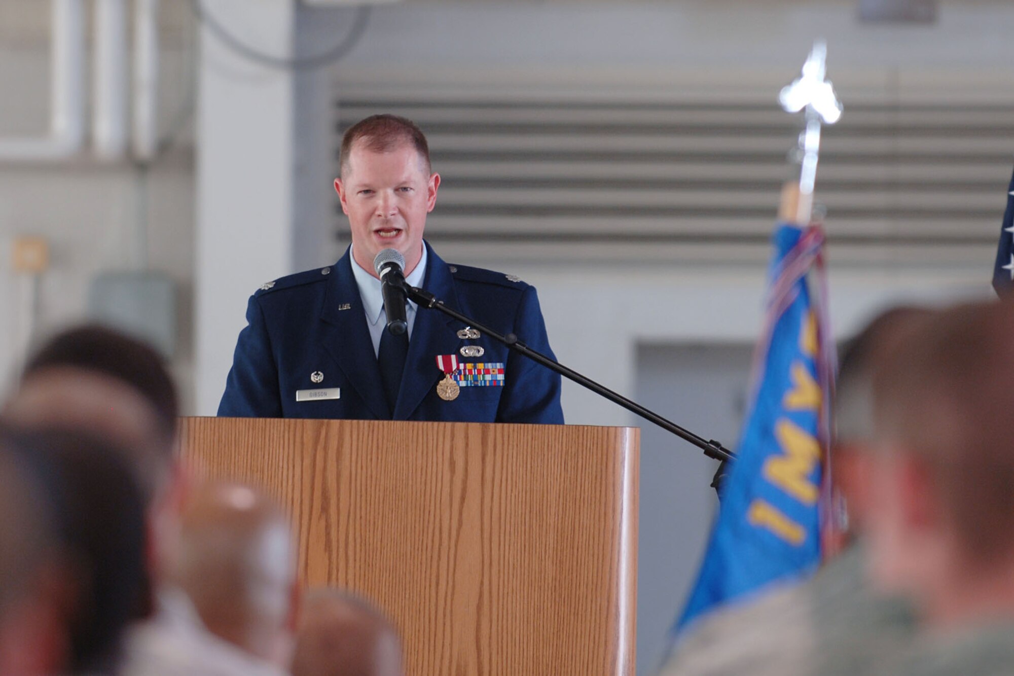 LANGLEY AIR FORCE BASE, Va. -- Lt. Col.  Jason Gibson, former 1st Equipment Maintenance Squadron commander, speaks to Airmen during the 1st Component Maintenance Squadron inactivation and 1st Equipment Maintenance Squadron re-designation ceremony at the 149th Fighter Squadron Hangar Oct. 29. Colonel Gibson is the last commander of the 1 EMS, as Maj. Elizabeth Boehm, former 1st Component Maintenance Squadron commander, took command of the re-named 1st Maintenance Squadron. (U.S. Air Force photo/Airman 1st Class Jason J. Brown) (RELEASED)