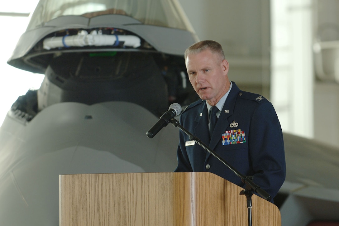 LANGLEY AIR FORCE BASE, Va. -- Col. George Zaniewski, 1st Maintenance Group commander, speaks during the 1st Component Maintenance Squadron inactivation and 1st Equipment Maintenance Squadron re-designation ceremony at the 149th Fighter Squadron Hangar Oct. 29. Airmen from the two maintenance squadrons condensed into one large unit, known as the 1st Maintenance Squadron. (U.S. Air Force photo/Airman 1st Class Jason J. Brown) (RELEASED)