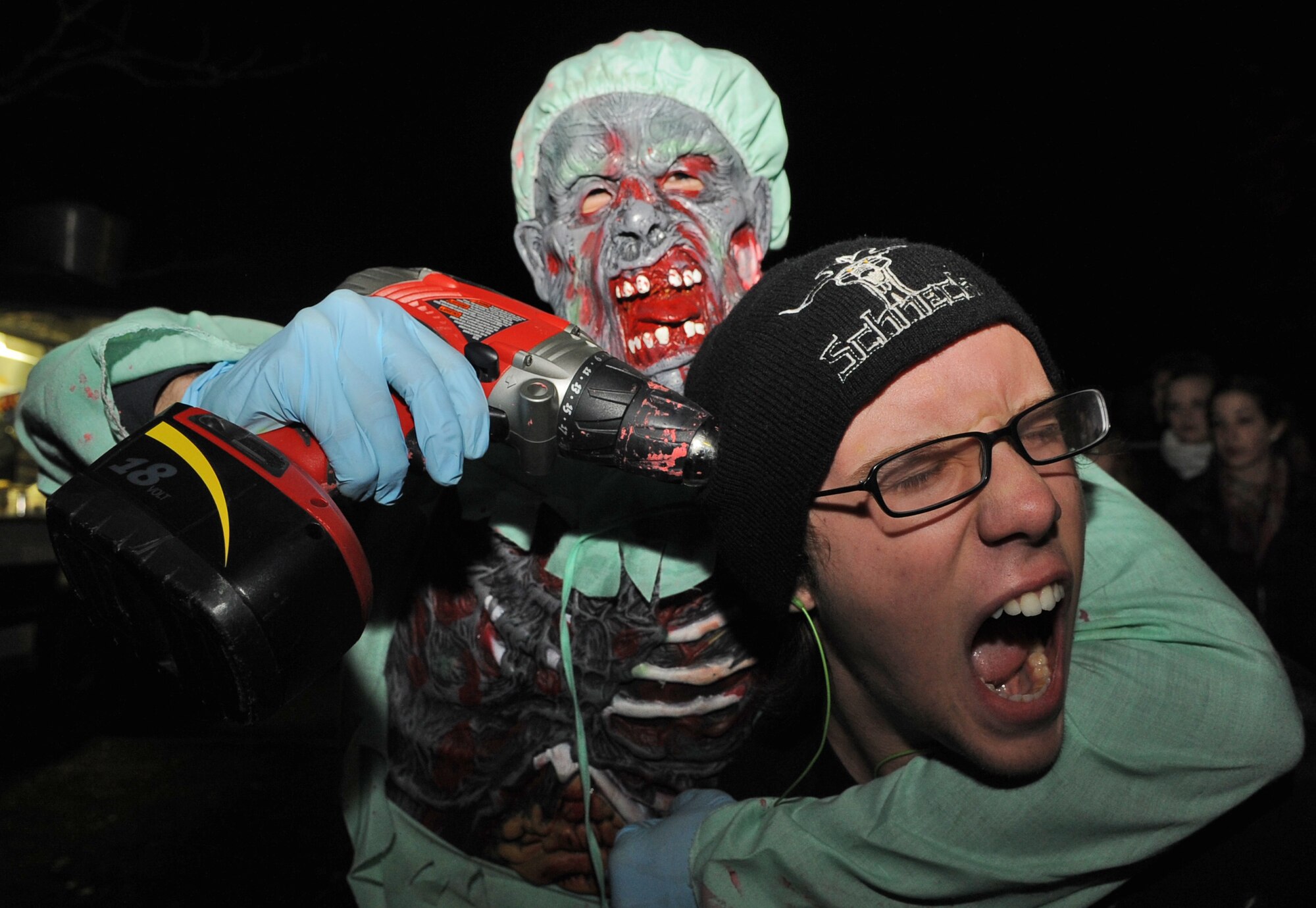 SPANGDAHLEM AIR BASE, Germany – Staff Sgt. Lee Davis, 52nd Logistics Readiness Squadron, scares Robir Montana at Bitburg Air Base’s Haunted House event. The three-day event was open to the base and local national community. (U.S. Air Force photo/Senior Airman Nick Wilson)