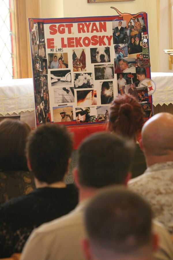 Marines and family members mourn fallen Marine Sgt. Ryan E. Lekosky during his memorial service at Belle Chasse Naval Air Station Joint Reserve Base, LA, Nov. 3, 2010. Lekosky was killed early Sunday morning Nov. 1, 2010 in the French Quarter after having attended the Marine Corps Birthday Ball.