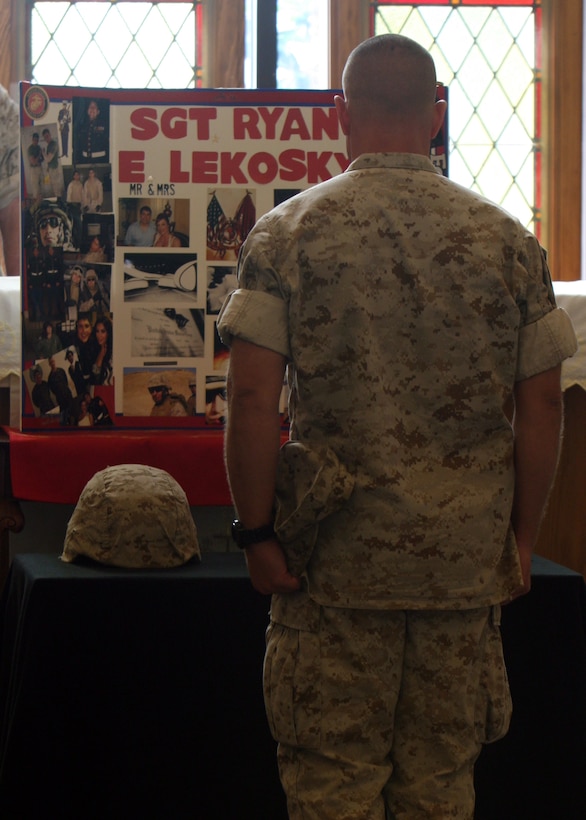 A Marine mourns fallen Marine Sgt. Ryan E. Lekosky during his memorial service at Belle Chasse Naval Air Station Joint Reserve Base, LA, Nov. 3, 2010. Lekosky was killed early Sunday morning Nov. 1, 2010 in the French Quarter after having attended the Marine Corps Birthday Ball.