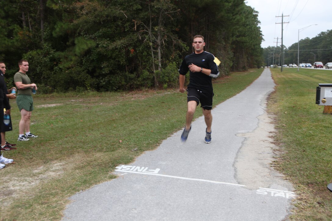 Pvt. Corey Bullock, a tank mechanic with 2nd Tank Battalion, 2nd Marine Division, approaches the finish line during the Marine Corps Community Services’ 5K Liberty Fun Run aboard Marine Corps Base Camp Lejeune, Nov. 4.  Service members, Department of Defense employees and retired military members completed the three-mile race in honor of the Marine Corps birthday and Veterans Day holidays.