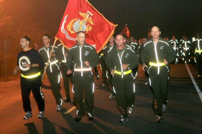 Brig. Gen. Michael Dana, 2nd Marine Logistics Group commanding general (center), led Marines and sailors with 2nd MLG in a fun run aboard Camp Lejeune, N.C., Nov. 4, 2010.  The run was part of the Marine Corps’ 235th birthday celebration.  (U.S. Marine Corps photo by Lance Cpl Anthony Kidd)