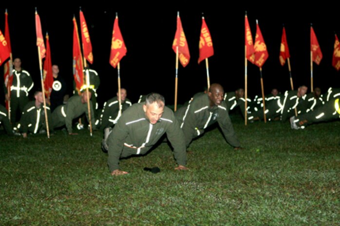 Brig. Gen. Michael Dana, 2nd Marine Logistics Group commanding general (left), and the sergeant major of the Marine Corps, Sgt. Maj. Carlton W. Kent (right), lead the MLG Marines and sailors in pyramid push-ups at the conclusion of the 2nd MLG fun run aboard Camp Lejeune, N.C., Nov. 4, 2010.  Dana and Kent addressed the Marines in recognition of the Marine Corps’ 235th birthday.  (U.S. Marine Corps photo by Lance Cpl Anthony Kidd)