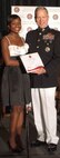 Tatiana Pile accepts her Marine Corps Scholarship Foundation Scholarship award from General James Amos, Assistant Commandant of the Marine Corps.