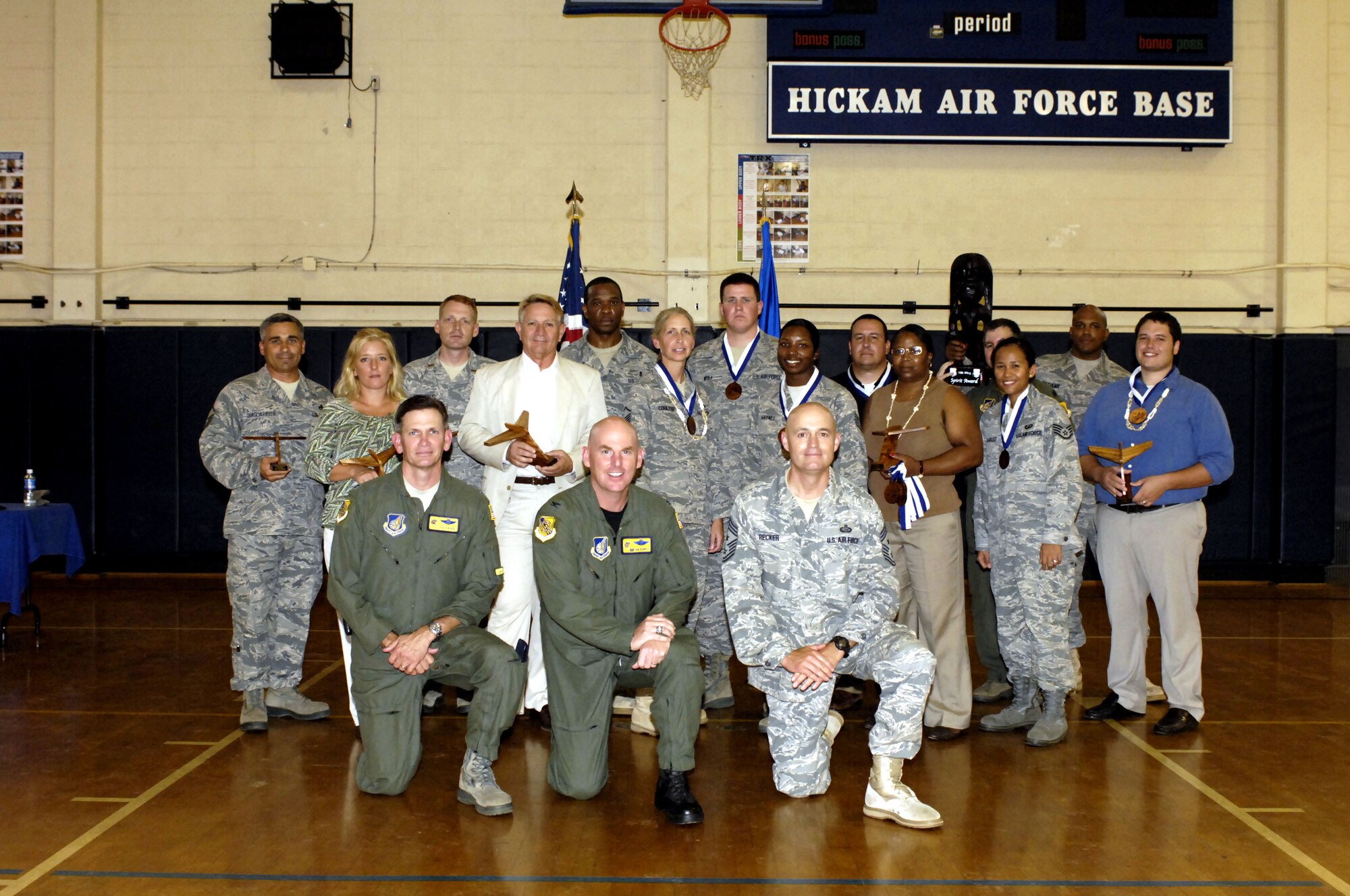 Winners from the 15th Wing award ceremony pose for a picture after winning their respective categories Oct. 19 at the Hickam gym. (U.S. Air Force photo/Dave Underwood)
