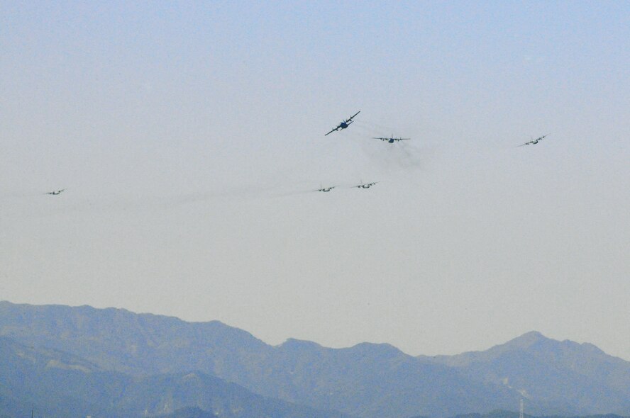 YOKOTA AIR BASE, Japan -- C-130 Hercules aircraft from the 36th Airlift Squadron fly over Yokota for a mission during a seven-ship sortie. The squadron is the only forward-based tactical airlift squadron in the Pacific region. They provide C-130 aircrews to conduct theater airlift, special operations, aeromedical evacuation, search and rescue, repatriation and humanitarian relief missions. (U.S. Air Force photo/ Airman 1st Class Katrina Menchaca)
