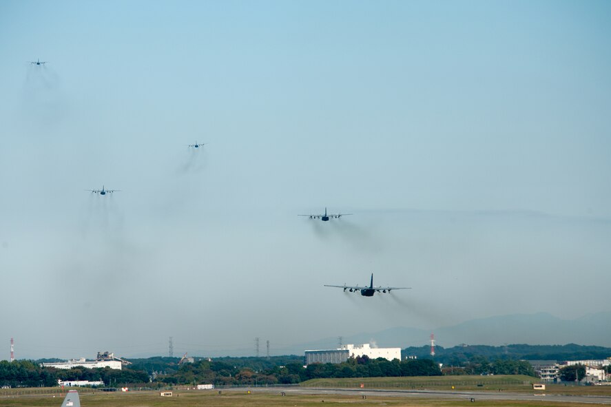 YOKOTA AIR BASE, Japan -- C-130 Hercules aircraft from the 36th Airlift Squadron take off for a mission during a seven-ship sortie. The squadron is the only forward-based tactical airlift squadron in the Pacific region. They provide C-130 aircrews to conduct theater airlift, special operations, aeromedical evacuation, search and rescue, repatriation and humanitarian relief missions. (U.S. Air Force photo/Osakabe Yasuo)