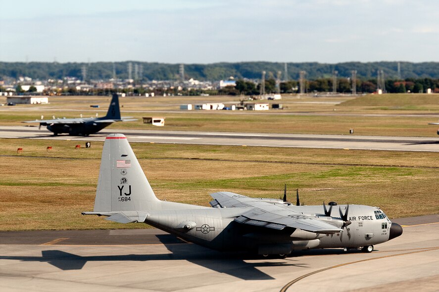 YOKOTA AIR BASE, Japan -- C-130 Hercules aircraft from the 36th Airlift Squadron taxi out for a mission during a seven-ship sortie. The squadron is the only forward-based tactical airlift squadron in the Pacific region. They provide C-130 aircrews to conduct theater airlift, special operations, aeromedical evacuation, search and rescue, repatriation and humanitarian relief missions. (U.S. Air Force photo/Osakabe Yasuo)