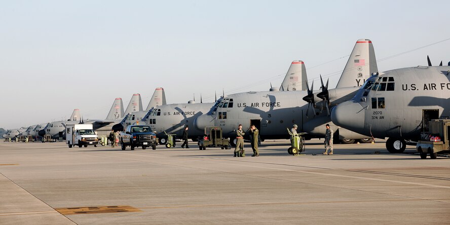YOKOTA AIR BASE, Japan -- Members of the 374th Aircraft Maintenance Squadron, 374th Maintenance Squadron, and 36th Airlift Squadron prepare for launching as part of a seven-ship formation of C-130's here Nov. 4. (U.S. Air Force photo/Osakabe Yasuo)