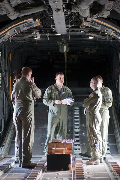 YOKOTA AIR BASE, Japan -- Aircrew from 36th Airlift Squadron have meeting on a C-130 Hercules Nov. 4 before launching as part of a seven-ship formation flight. (U.S. Air Force photo/Osakabe Yasuo)