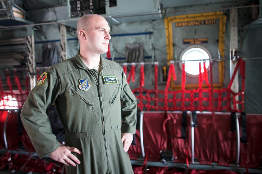 YOKOTA AIR BASE, Japan -- Airman 1st Class Noel Jones, 36th Airlift Squadron, completes a pre-flight check on a C-130 Hercules here Nov. 4 before launching as part of a seven-ship formation flight. (U.S. Air Force photo/Osakabe Yasuo)