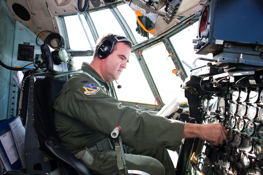 YOKOTA AIR BASE, Japan -- Col. Mark Hering, 374th Operations Group commander, performs a pre-flight check on a C-130 Hercules here Nov. 4 before launching as part of a seven-ship formation flight. (U.S. Air Force photo/Osakabe Yasuo)