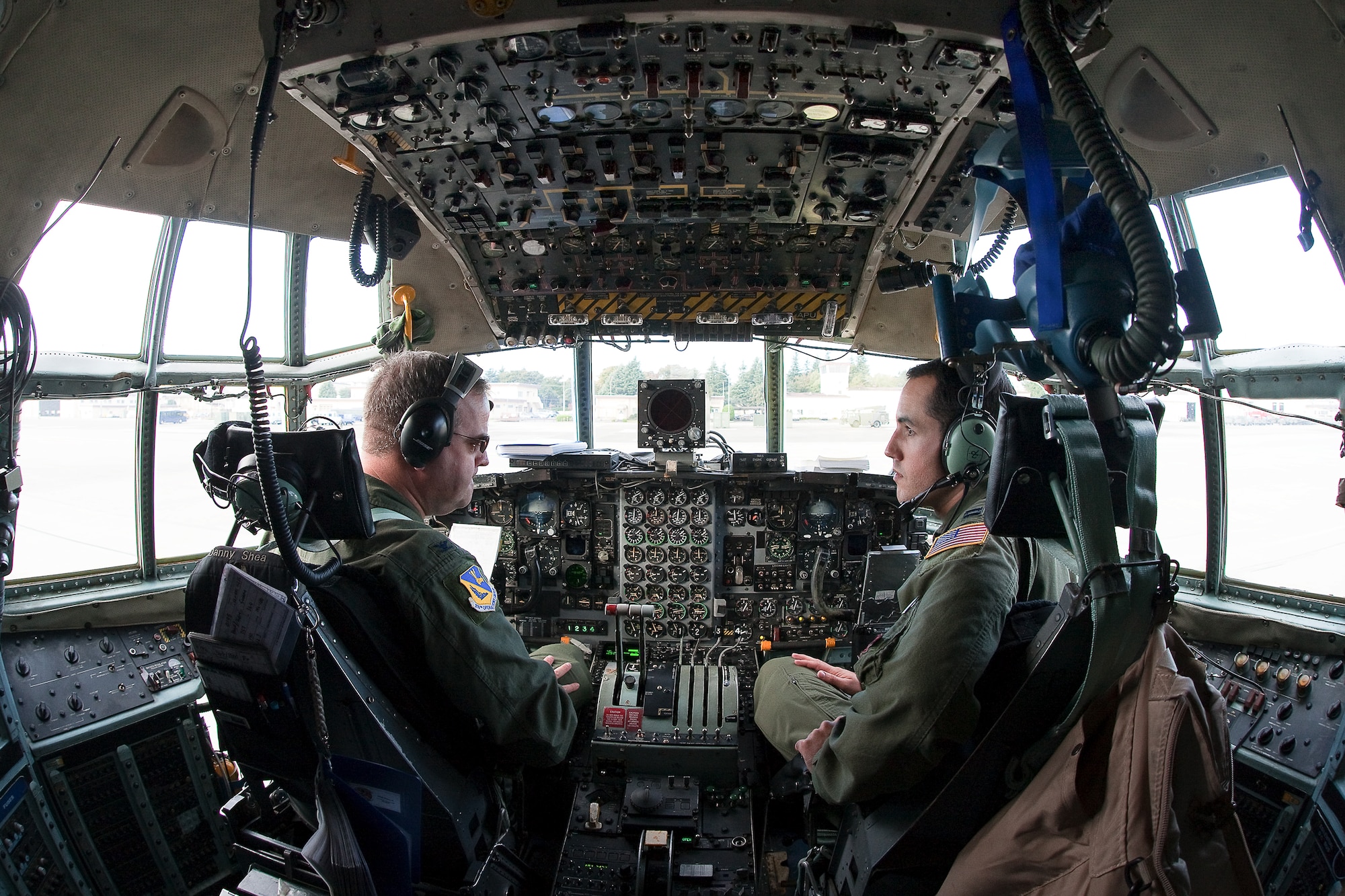 YOKOTA AIR BASE, Japan -- Col. Mark Hering (left), 374th Operations Group commander, and Capt. Chirs McClintock (right), 36th Airlift Squadron, perform a pre-flight check on a C-130 Hercules Nov. 4 before launching as part of a seven-ship formation flight. (U.S. Air Force photo/Osakabe Yasuo)
