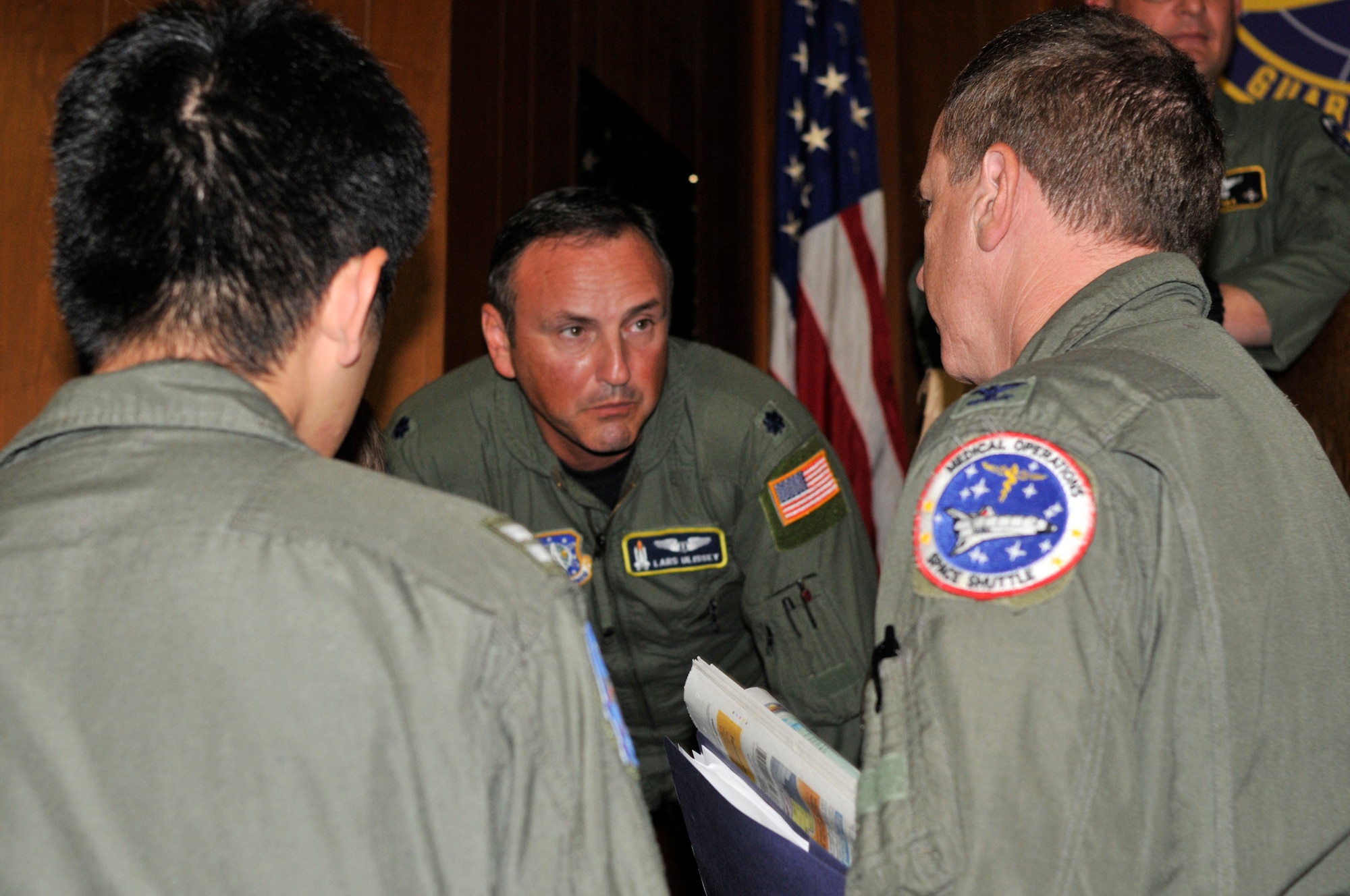 PATRICK AIR FORCE BASE, Fla. - Air Force Lt. Col. Lars Ulissey, 45th Space Wing Chief of Bioastronautics, Det. 3, Medical Division, briefs four flight surgeons during the Shuttle Joint Task Force in briefing Nov. 3, at the 301st Rescue Squadron here. The briefings are held to prepare those who are here supporting the emergency portion of the space shuttle Discovery launch Nov. 5. (U.S. Air Force photo/Capt. Cathleen Snow)