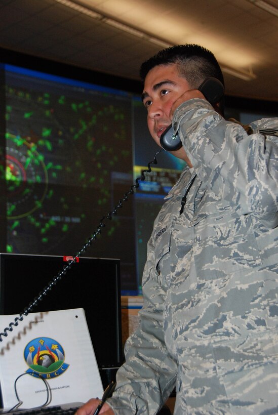 Staff Sgt. José Barrera, senior air defense technician with the 601st Air & Space Operations Center at Tyndall AFB, Fla., performs his daily mission in ‘America’s AOC.’  Sergeant Barrera employed his Spanish-speaking skills during a search and rescue operation between Air Force Rescue Coordination Center and the Mexican Rescue Coordination Center Oct. 15, 2010. (U.S. Air Force photo/Maj. Steve Burke)