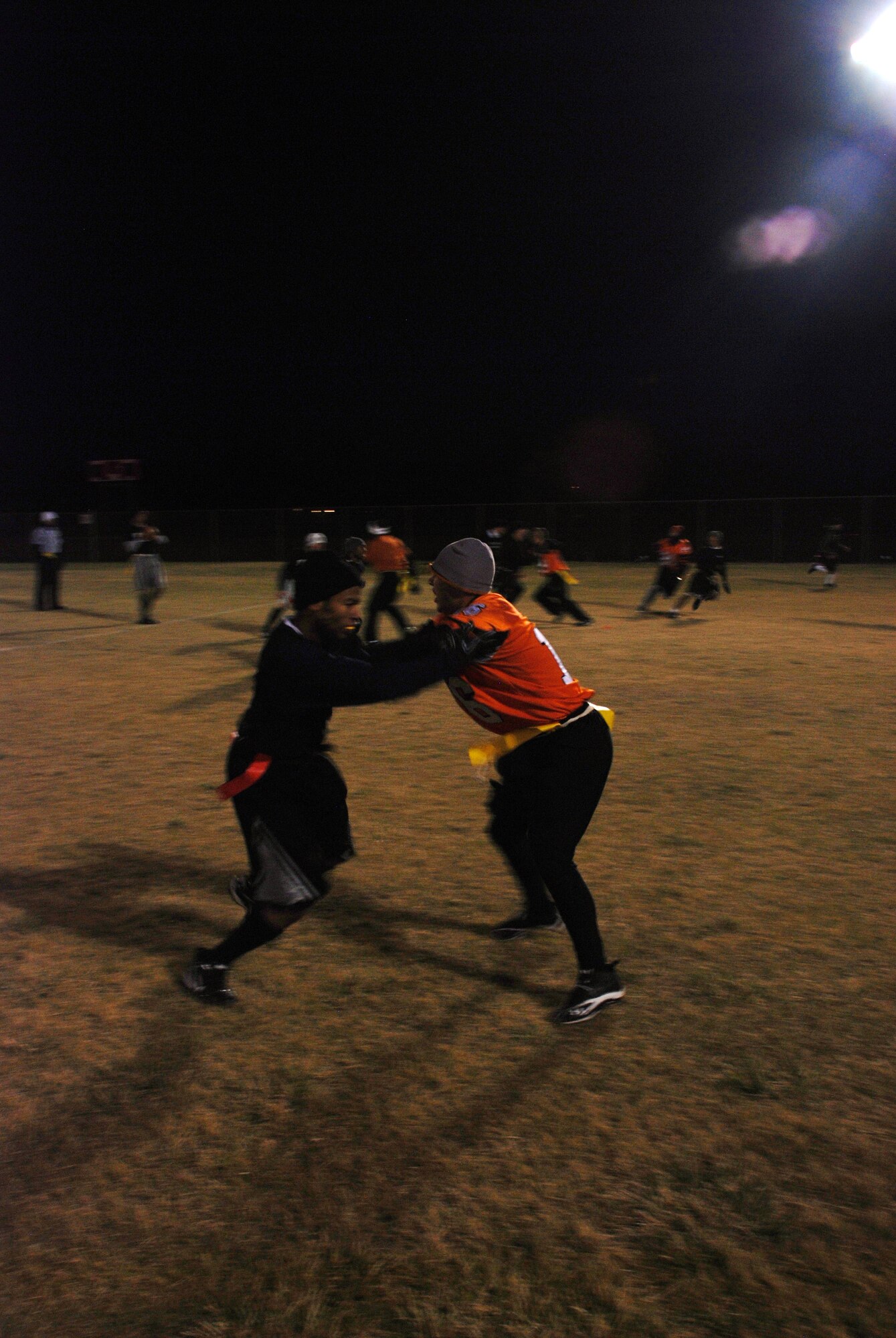A member of the 90th Security Forces Group’s football team attempts to break the route of a 90th Maintenance Group receiver during the final minutes of the base football intramural championship game Oct. 27. (U.S. Air Force photo by Airman 1st Class Dan Gage)