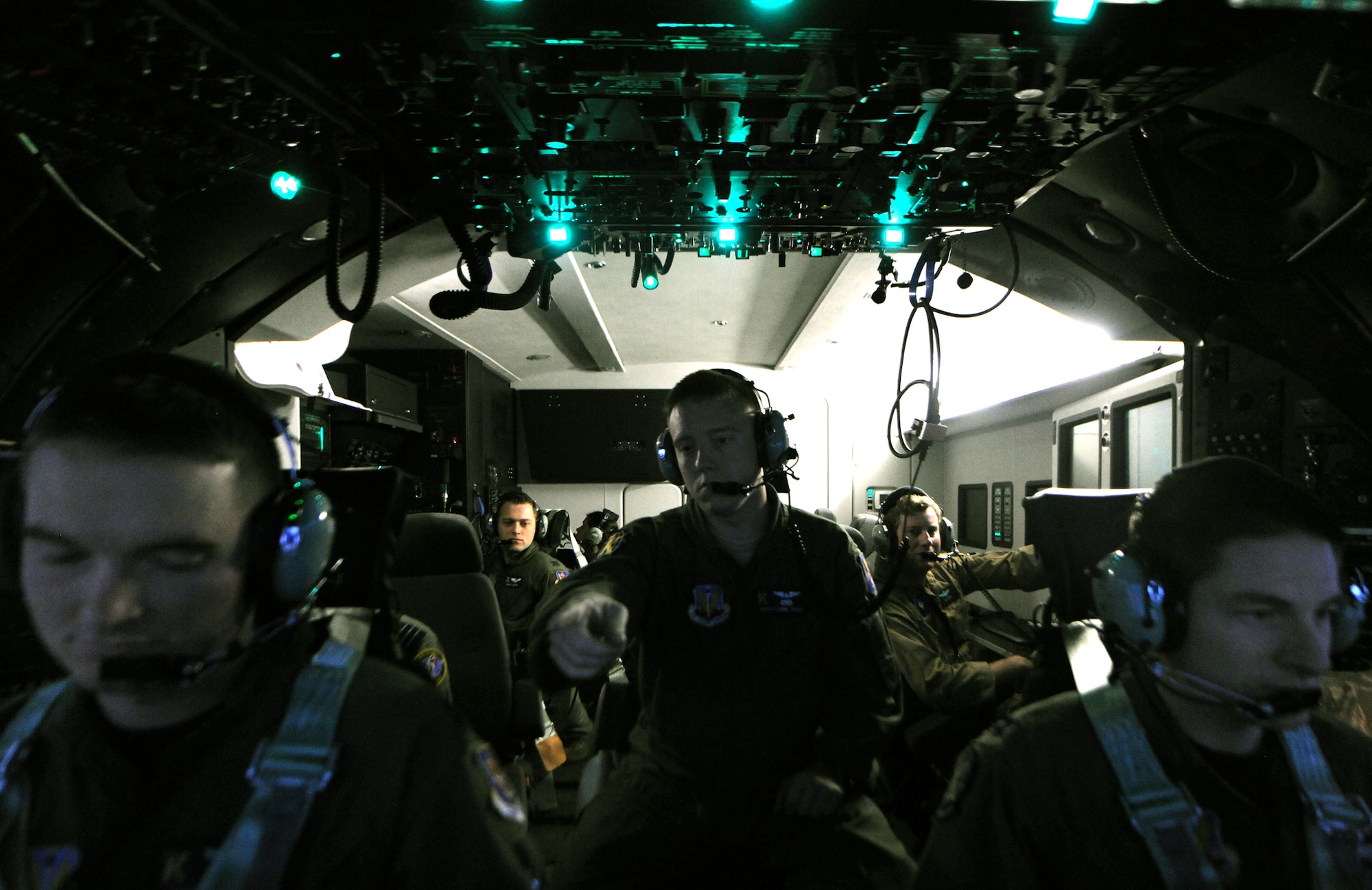A crew prepares to "take off" in a C-130 Hercules simulator during training Nov. 1, 2010, at Moody Air Force Base, Ga. The crew consisted of two pilots, a flight engineer, a navigator and a communications specialist, all of whom are going through the simulator class as a group. (U.S. Air Force photo/Airman 1st Class Benjamin Wiseman)