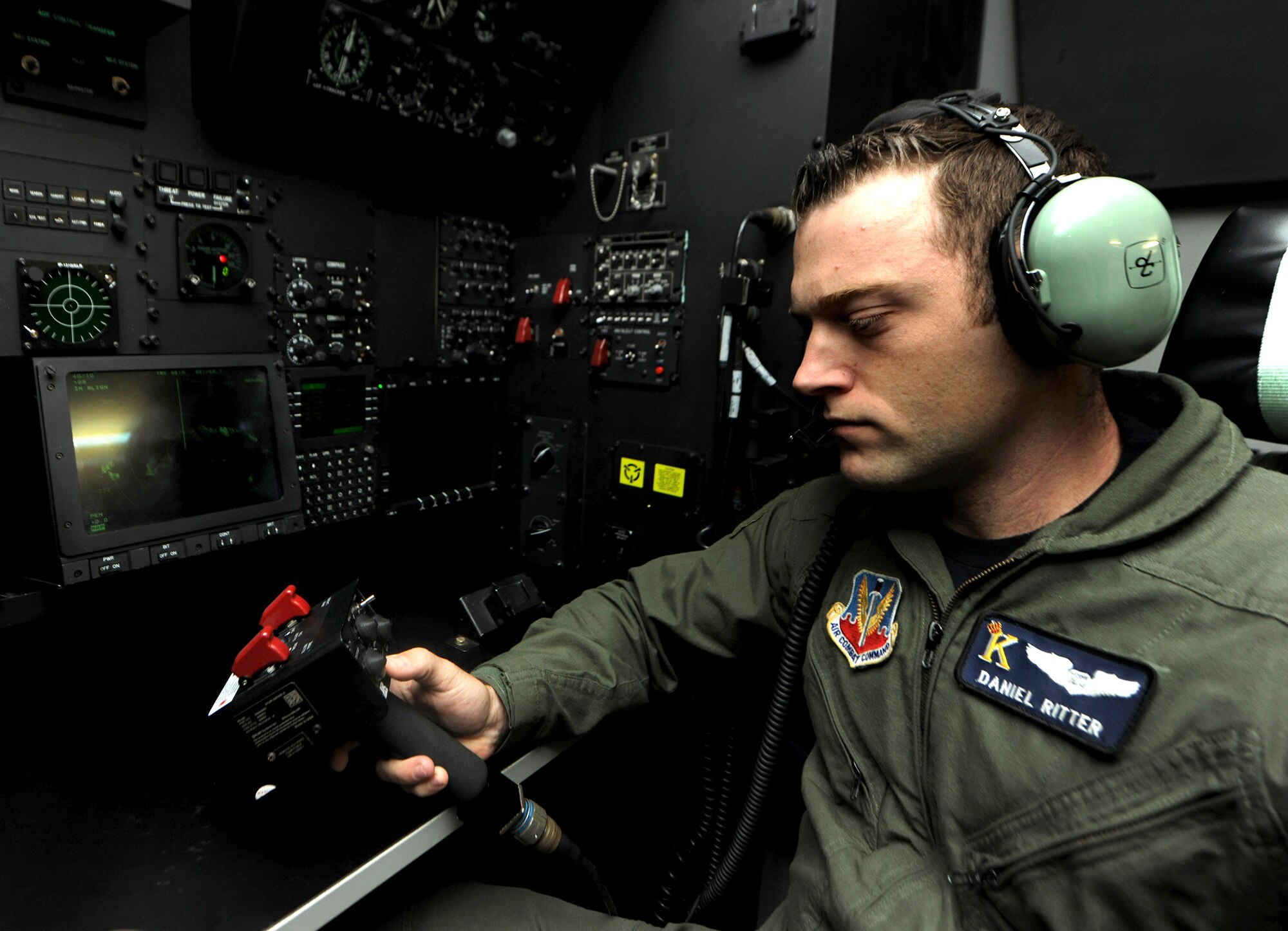 Capt. Daniel Ritter uses the controls to the forward-looking infrared system while flying in the C-130 Hercules simulator Nov. 1, 2010, at Moody Air Force Base, Ga. The infrared system allows the crew to see harsh terrain during dense fog and hours of darkness. Captain Ritter is a 71st Rescue Squadron navigator. (U.S. Air Force photo/Airman 1st Class Benjamin Wiseman)