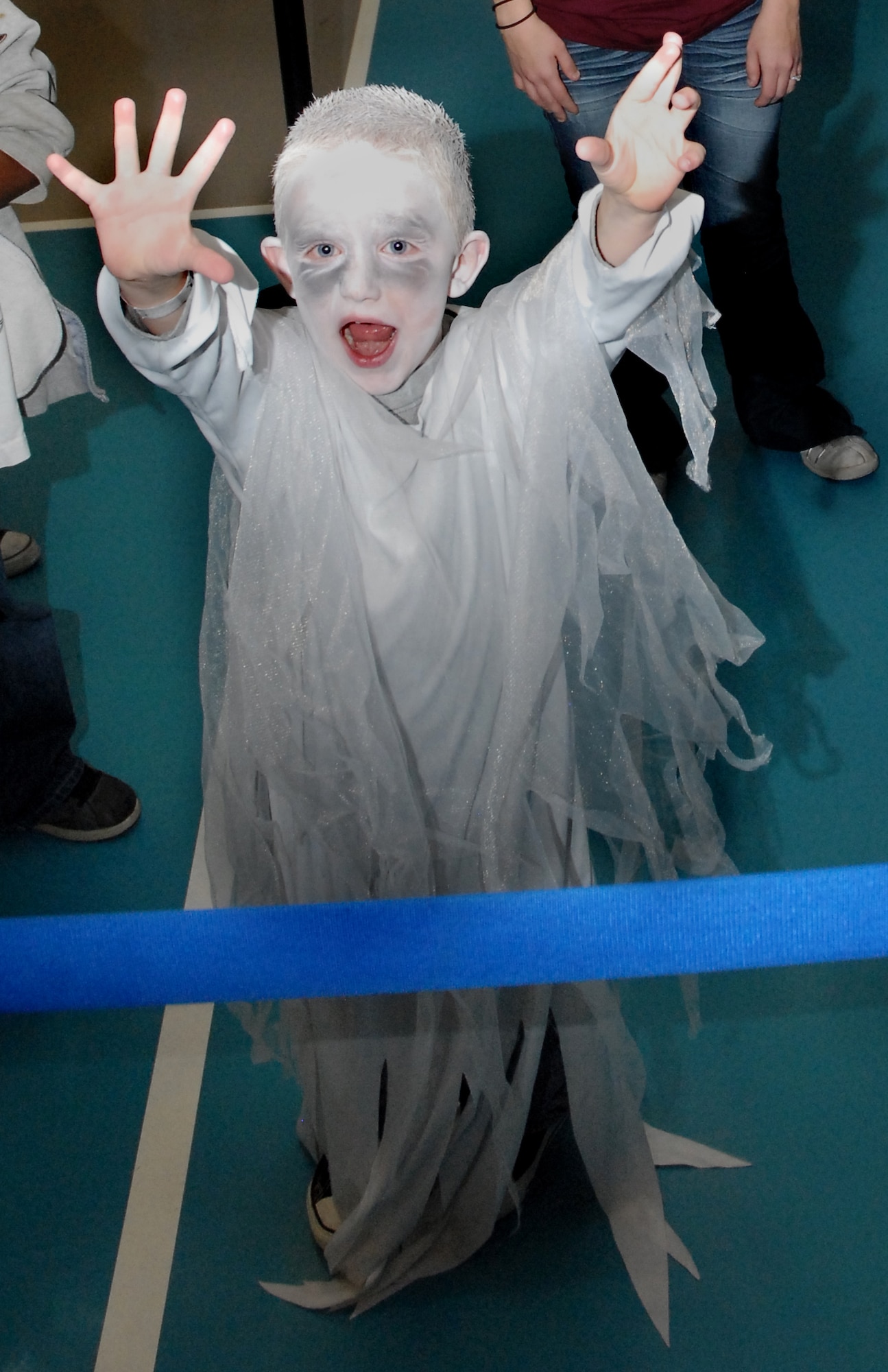 Cole, 5, gives the camera a scare Oct. 29 at the Youth Programs Center Fall Festival. Cole was among 200 other children who came out to play games, win prizes and go home with a bag of candy. (U.S. Air Force photo/Staff Sgt. Dillon White)