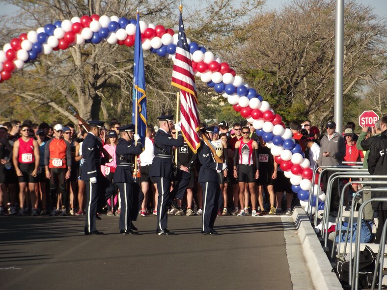 The Kirtland AFB honor guard presents the colors Oct. 30 before the start of the Wounded Warrior Triathlon.