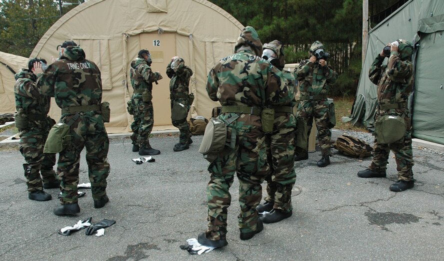 Airmen from Youngstown Air Reserve Station, Ohio transition from Mission Oriented Protective Posture level two to level four in one of the challenges at the Services Readiness Competition at Dobbins Air Reserve Base, Ga. Nov 2-4.  Six teams from around the Air Force Reserve Command gathered to participate in 11 events and promoted skill enhancement and group cohesion amongst Air Force Services Agency personnel. (U.S. Air Force photo/Senior Airman Danielle Campbell)