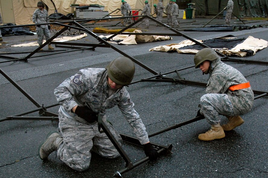 Airmen from Wright-Patterson Air Force Base, Ohio set up Single Pallet Expeditionary Kitchen during one of the challenge at the Services Readiness Competition at Dobbins Air Reserve Base, Ga. Nov. 2-4.  Six teams from around the Air Force Reserve Command participated in the events which comprised 11 contests designed to promote skill enhancement and group cohesion amongst Air Force Services Agency personnel.  (U.S. Air Force photo/Senior Airman Danielle Campbell)