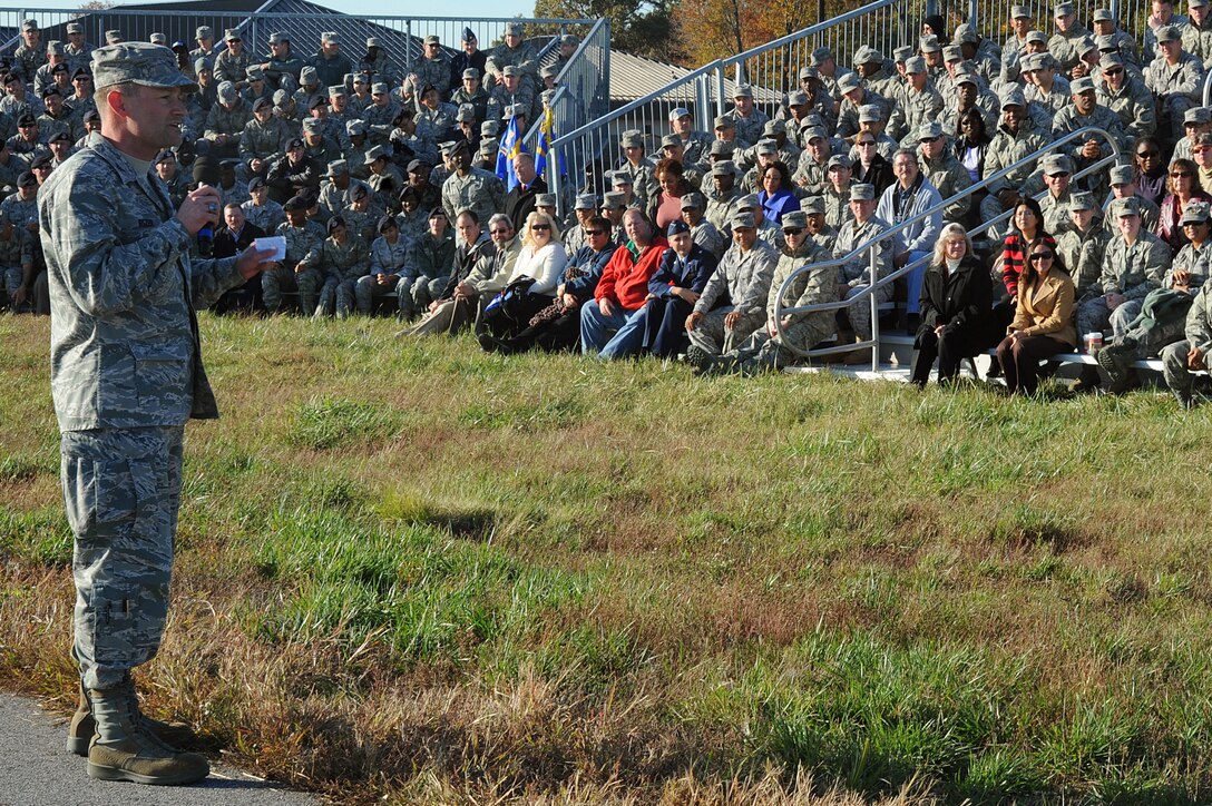 Col. Ken Rizer, 11th Wing commander, speaks about the mission of the wing during his commander's call on the Joint Base Andrews flightline Nov 2. The commander's call highlighted the unique assets of the 11 WG through demonstrations by the 1st Helicopter Squadron, the Air Force Honor Guard, and the Air Force Band.  (U.S. Air Force photo by Senior Airman Melissa V. Brownstein)