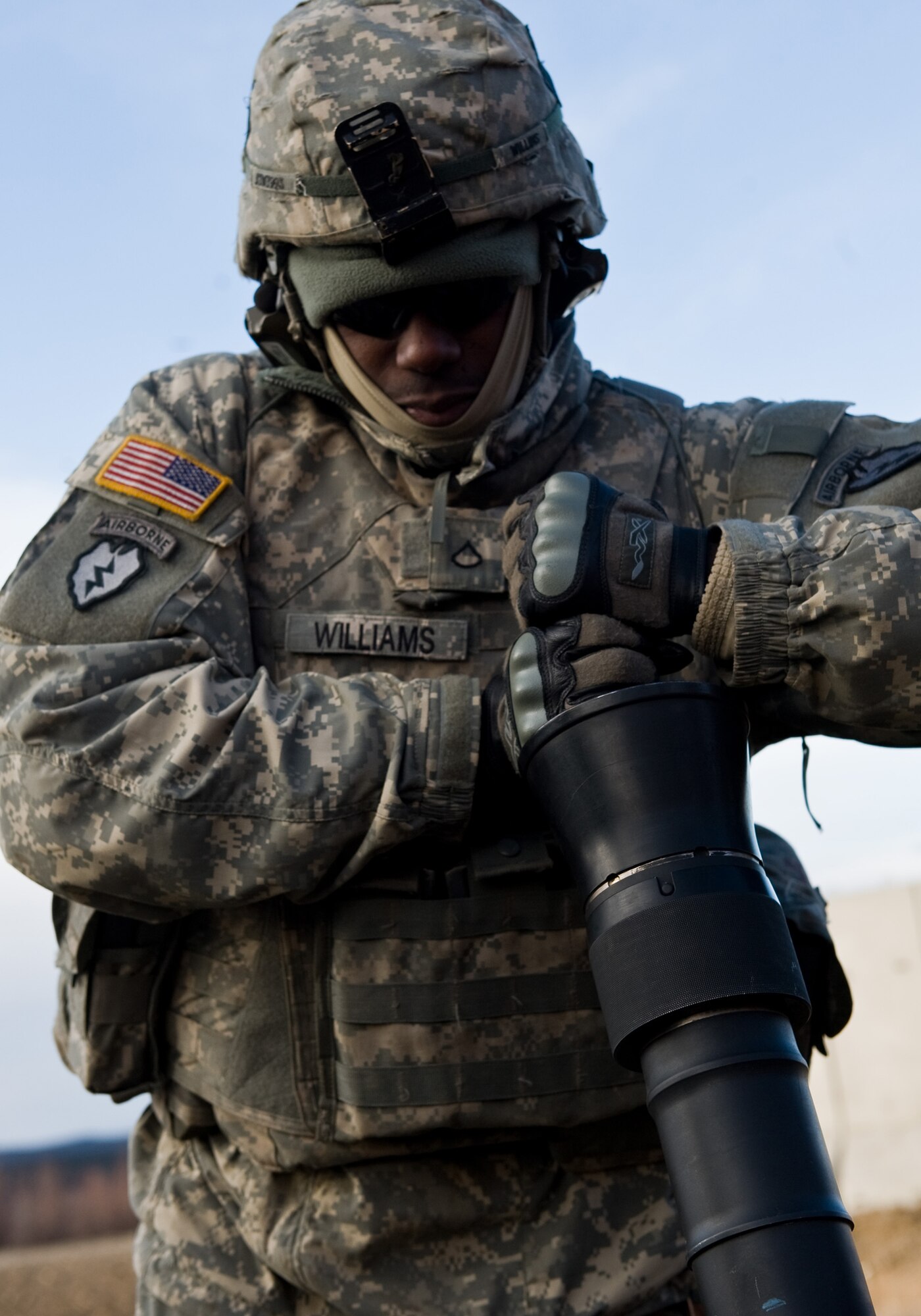 FORT GREELY, Alaska ? Spc. Darnell Williams of the 1st Battalion, 501st Infantry Regiment (Airborne) cleans out the barrel of an 81 mm mortar system after it was done being fired during a training exercise Oct. 28. Soldiers from the 501st IR participated in field-training exercises, with the first elements arriving to Donnelly Training Area, Fort Greely, Alaska Oct. 14 and the last of the Soldiers scheduled to leave Nov. 10. (U.S. Air Force photo/Airman 1st Class Christopher Gross)