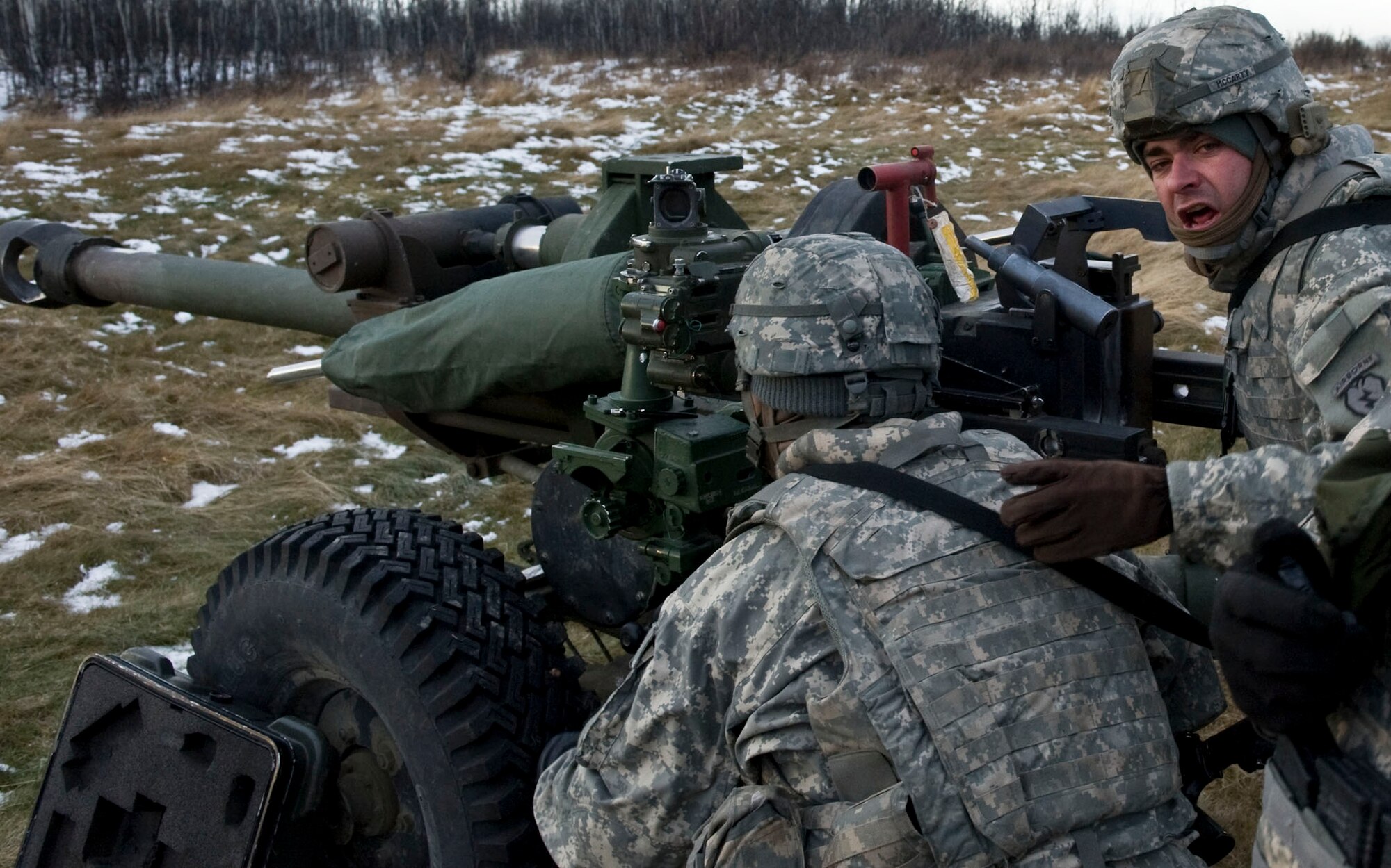 FORT GREELY, Alaska ? Staff Sgt. Matthew McCarty of the 377th Parachute Field Artillery Regiment yells out instructions while his section tries to get certified on the M119 105 mm howitzer Oct. 28. Soldiers from the 1st Battalion, 501st Infantry Regiment (Airborne) participated in field-training exercises, with the first elements arriving to Donnelly Training Area, Fort Greely, Alaska Oct. 14 and the last of the Soldiers scheduled to leave Nov. 10. (U.S. Air Force photo/Airman 1st Class Christopher Gross)