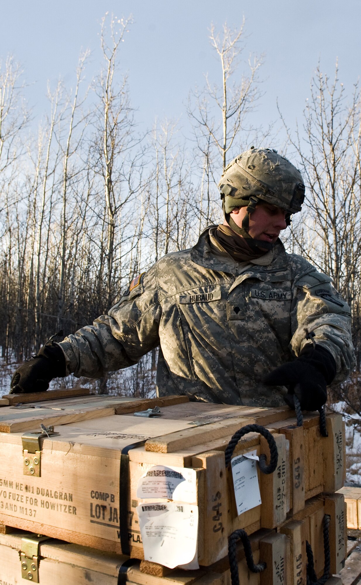 FORT GREELY, Alaska ? Spc. Matthew Hubaud of the 377th Parachute Field Artillery Regiment lifts a box M119 105 mm howitzer ammunition during a live-fire exercise Oct. 28. Soldiers from the 1st Battalion, 501st Infantry Regiment (Airborne) participated in field-training exercises, with the first elements arriving to Donnelly Training Area, Fort Greely, Alaska Oct. 14 and the last of the Soldiers scheduled to leave Nov. 10. (U.S. Air Force photo/Airman 1st Class Christopher Gross)