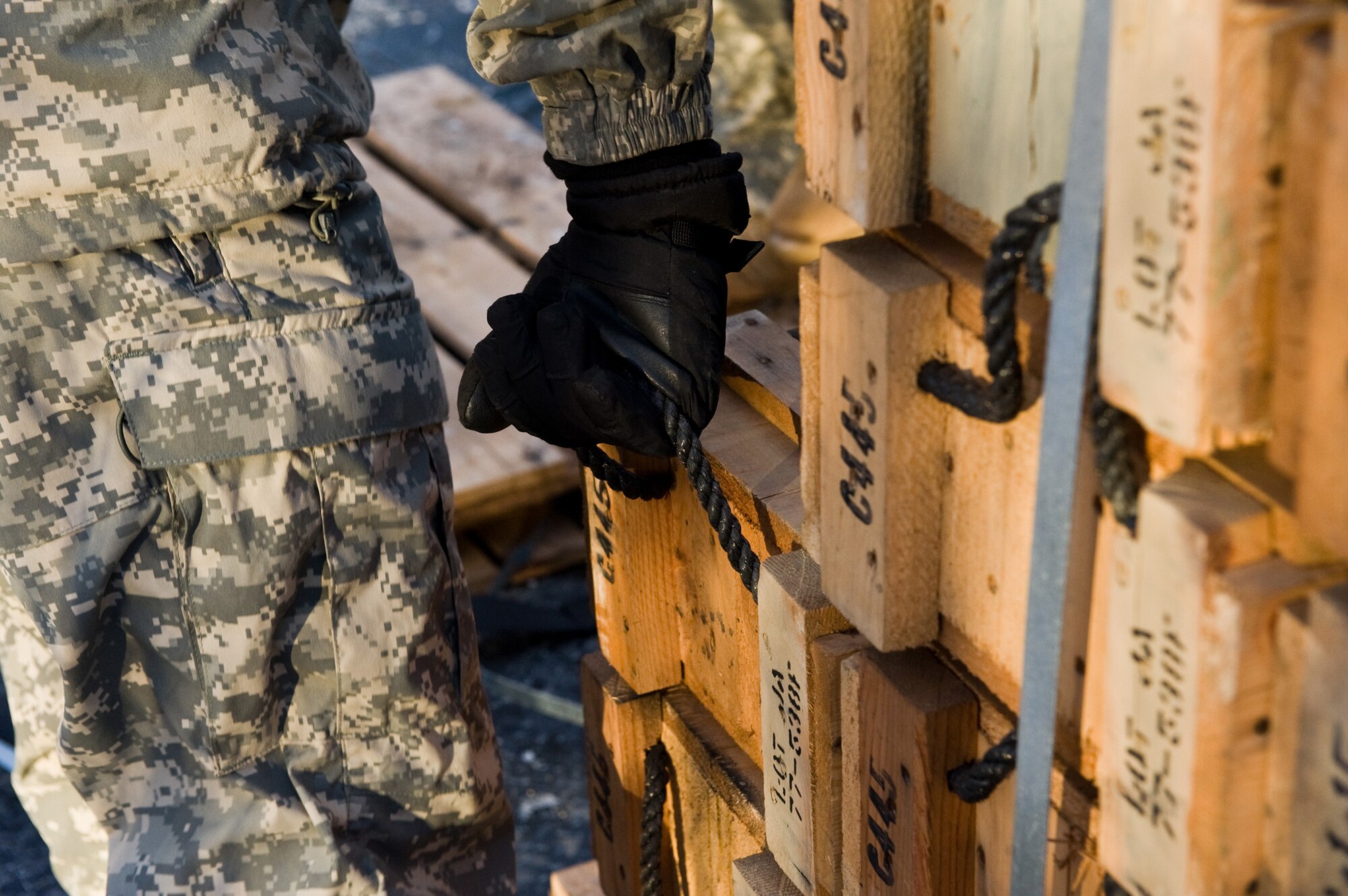 FORT GREELY, Alaska ? A Soldier with the 377th Parachute Field Artillery Regiment lifts a box M119 105 mm howitzer ammunition during a live-fire exercise Oct. 28. Soldiers from the 1st Battalion, 501st Infantry Regiment (Airborne) participated in field-training exercises, with the first elements arriving to Donnelly Training Area, Fort Greely, Alaska Oct. 14 and the last of the Soldiers scheduled to leave Nov. 10. (U.S. Air Force photo/Airman 1st Class Christopher Gross)