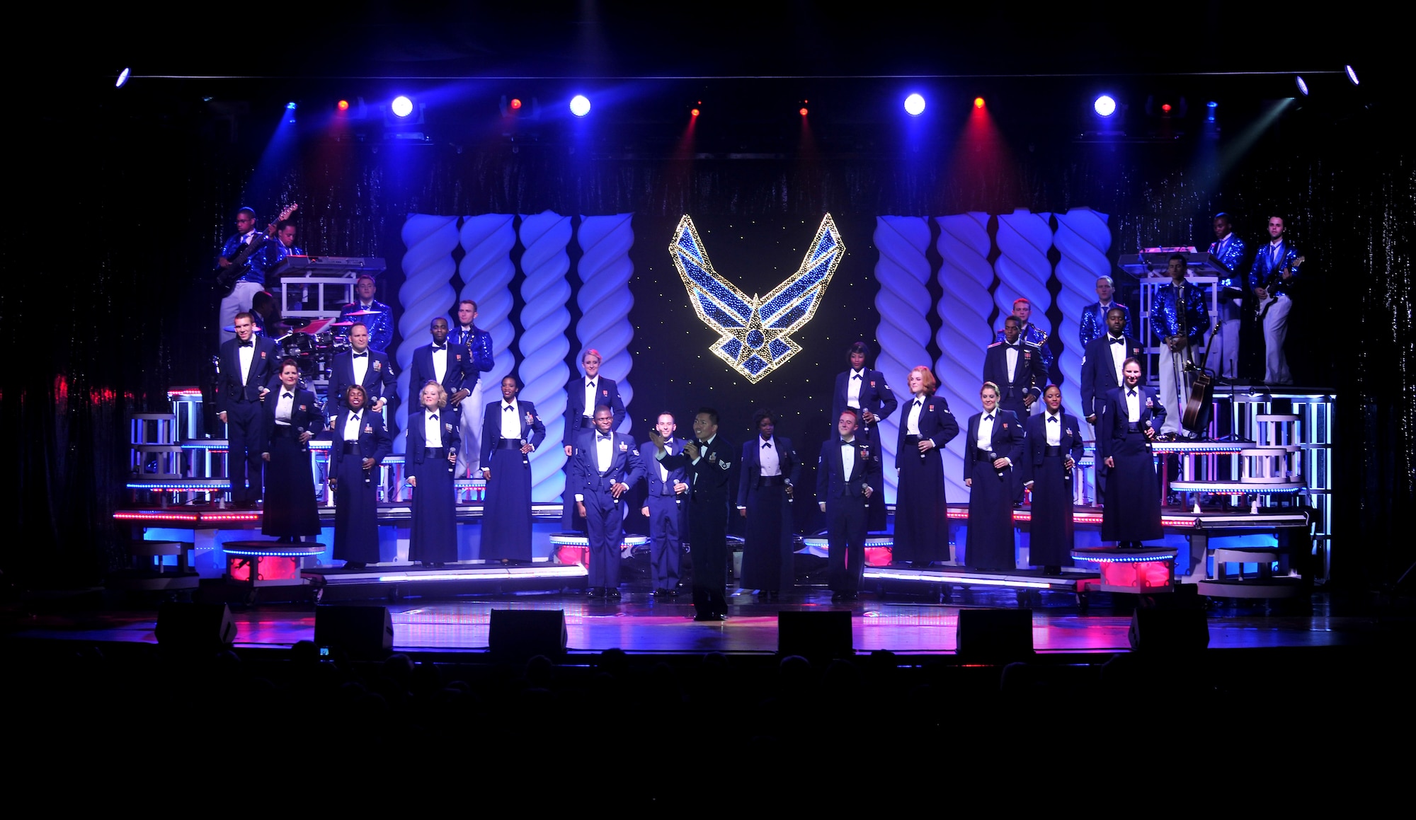 VALDOSTA, Ga. -- Tops In Blue members perform their final set, where they perform in their Mess Dress uniforms as they pay tribute to the men and women of the Air Force. Tops In Blue members travel with semi truck loads full of equipment to help them set up the stage, lights, curtains and whatever else is needed to create a spectacular stage for their performance. (U.S. Air Force photo/Airman 1st Class Joshua Green)(RELEASED)
