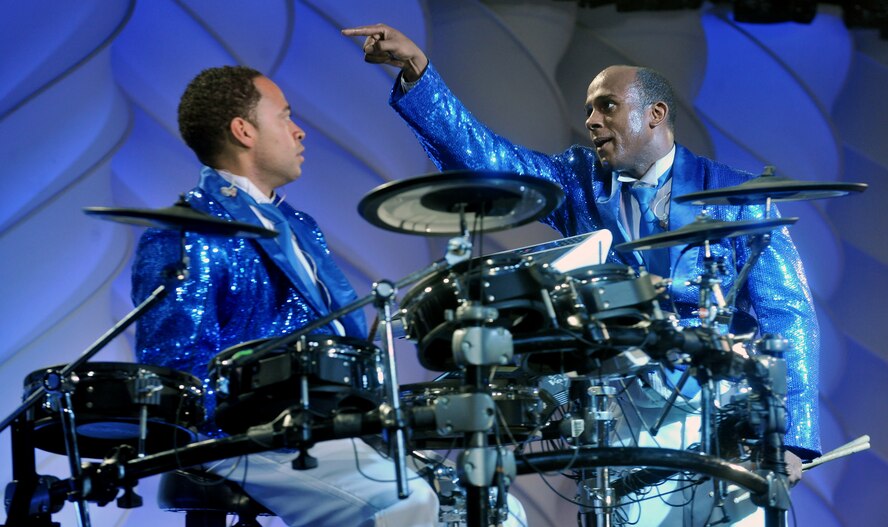 VALDOSTA, Ga. -- Senior Airman Breyson Robinson, Tops In Blue drums player and Airman 1st Class Jonathan Velasquez, Tops In Blue keyboard player, put on a humorous moment during their performance at the Valdosta Performing Arts Center Nov. 2. Besides musical entertainment the Tops In Blue members put on different skits to keep the audience involved and feel like they are a part of the show. (U.S. Air Force photo/Airman 1st Class Joshua Green)(RELEASED)
