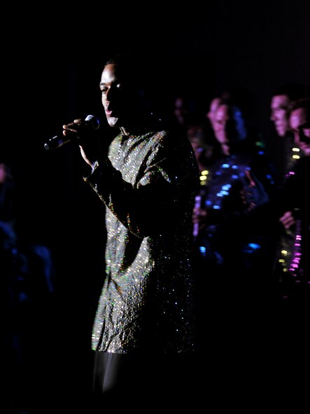 VALDOSTA, Ga. -- Capt. John Early, Tops In Blue officer in charge and vocalist, woos the female in the crowd during a slow song during his performance at the Valdosta Performing Arts Center Nov. 2. Tops In Blue members perform various renditions of popular songs throughout American culture. (U.S. Air Force photo/Airman 1st Class Joshua Green)(RELEASED)
