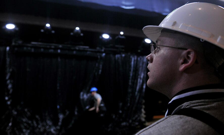 VALDOSTA, Ga. -- Staff Sgt. William Crothers, Tops In Blue staging director, looks toward the stage lights ensuring that every light is properly working before having them fully raised at the Valdosta Performing Arts Center Nov. 2. Not only do the Tops In Blue members sing and perform, they build and create the stage, a little known fact of what it takes to be a part of Tops In Blue. (U.S. Air Force photo/Airman 1st Class Joshua Green)(RELEASED)
