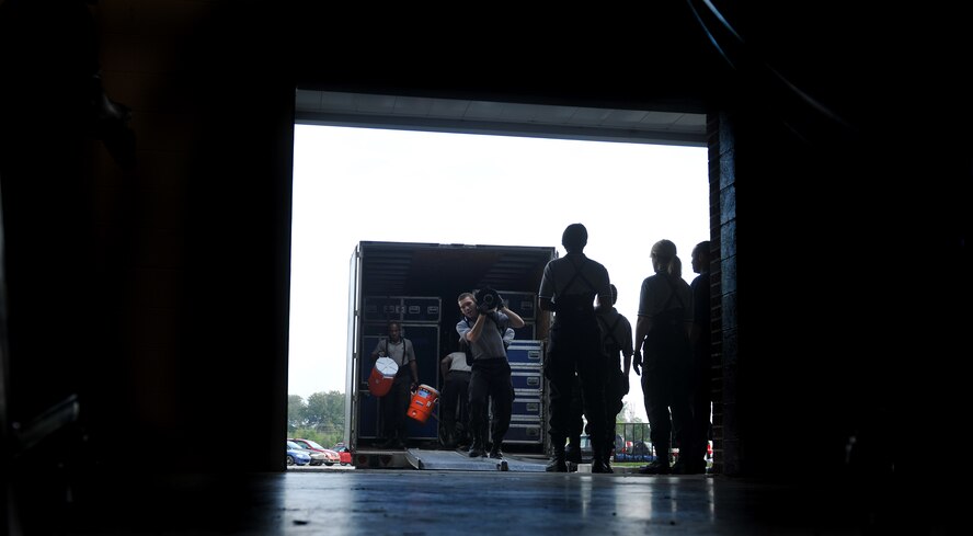 VALDOSTA, Ga. -- Members from the Tops In Blue performance group bring in equipment during stage preparation at the Valdosta Performing Arts Center Nov. 2. Before every show Tops In Blue members build and setup everything from the stage to the lighting, video and audio. (U.S. Air Force photo/Airman 1st Class Joshua Green)(RELEASED)
