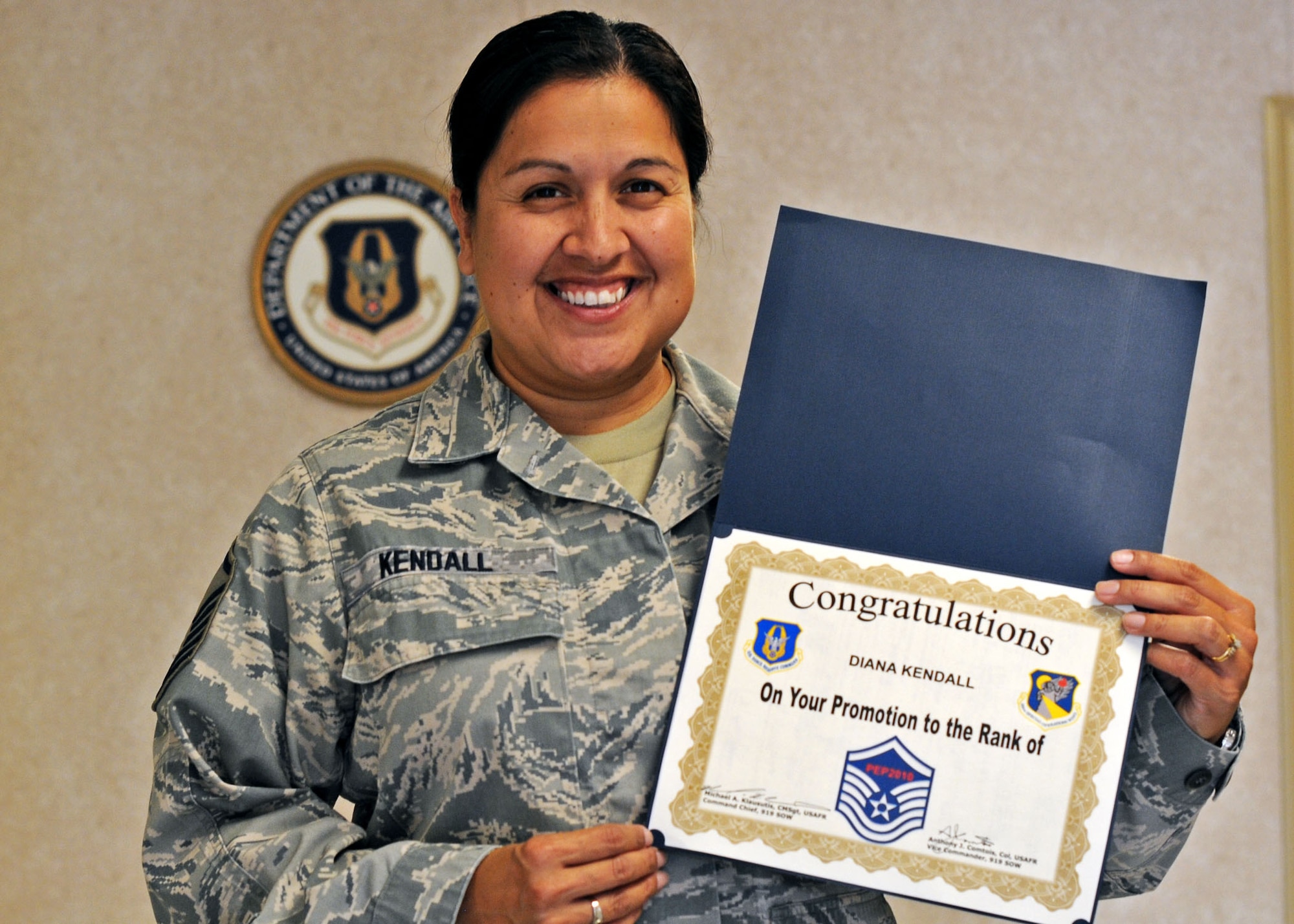 Master Sgt. Diana Kendall, 919th Special Operations Wing financial management, proudly displays the certificate she received during a surprise promotion ceremony Oct. 2 at Duke Field.   Sergeant Kendall was one of eight Duke Field reservists awarded immediate Promotion Enhancement Program promotions during the wing’s October unit training assembly. The PEP is a commander’s program designed to promote outstanding and well-deserving Air Force Reserve Airmen one grade above the authorized grade for their position.  Only those Airmen who show outstanding potential are considered based on a demonstrated ability to serve in the next higher grade.  (U.S. Air Force photo/Tech. Sgt. Samuel King Jr.)